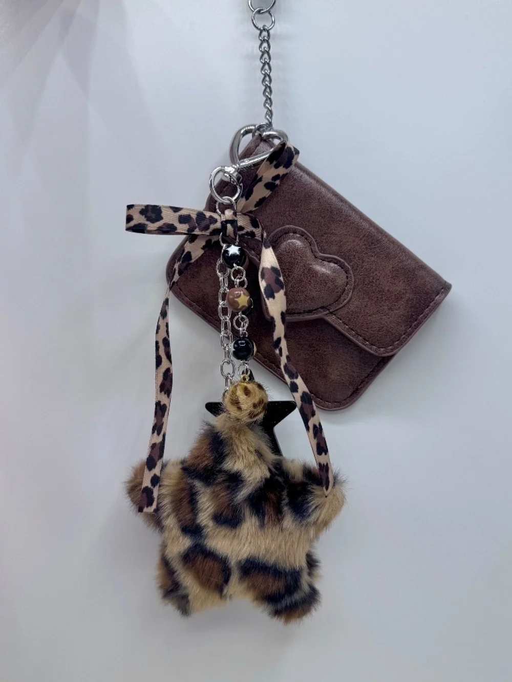 Elevate your everyday essentials with this chic brown card case keychain set. Fe